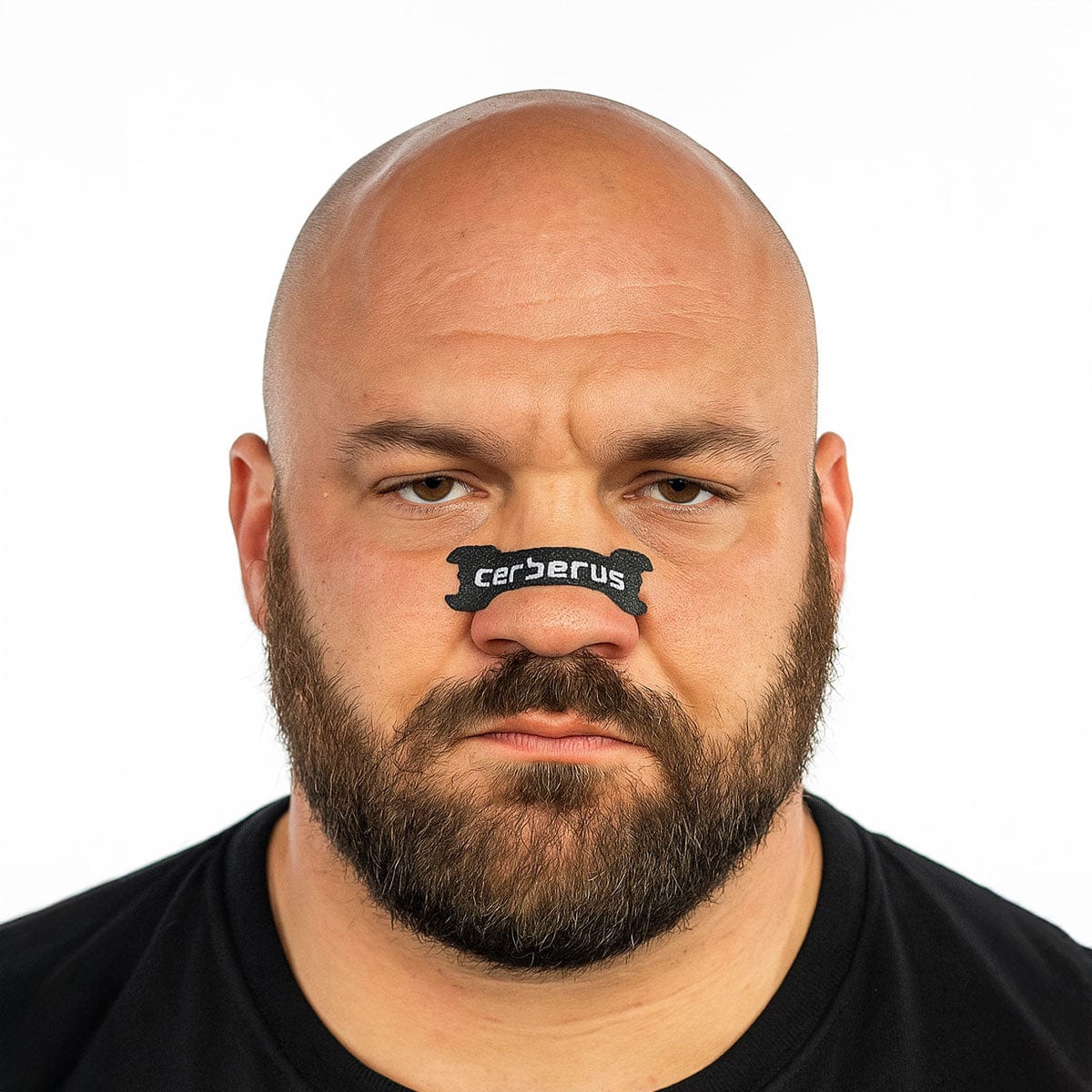 Man wearing a black 'cerberus' nose strip against a white background